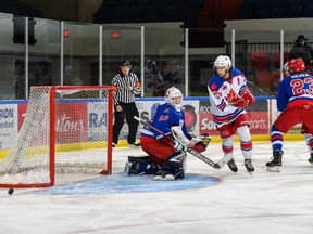 A puck goes just wide of the Cornwall goal and netminder Dax Easter. Photo on Dec., 6 in Cornwall, Ont. Robert Lefebvre/Special to the Cornwall Standard-Freeholder/Postmedia Network