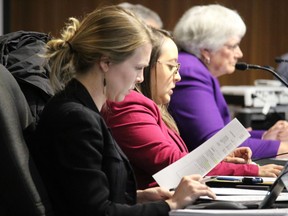 Coun. Elaine MacDonald in background, along with Coun. Carilyne Hebert (middle) and Coun. Sarah Good at a recent meeting. Photo in Cornwall, Ont. Todd Hambleton/Cornwall Standard-Freeholder/Postmedia Network