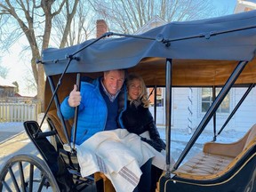 Andre and France Pommier enjoying a ride in the carriage they donated to Upper Canada Village on Wednesday, December 14. Handout/Cornwall Standard-Freeholder/Postmedia Network
