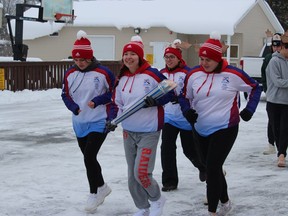 Massena Central School student Keely Bova heads out with schoolmates for the first leg of the run. Photo on Monday, December 19, 2022, in Akwesasne, N.Y. Todd Hambleton/Cornwall Standard-Freeholder/Postmedia Network