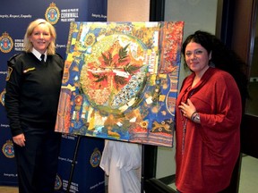 From left, Cornwall Police Services Chief of Police Shawna Spowart, with local artist Yafa Goawily during the unveiling of the One Circle art piece on Tuesday, December 20. Handout/Cornwall Standard-Freeholder/Postmedia Network