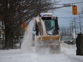The winter storm cleanup continued Monday in Cornwall, this blower clearing a sidewalk in the downtown area. Photo on Monday, December 26, 2022, in Cornwall, Ont. Todd Hambleton/Cornwall Standard-Freeholder/Postmedia Network