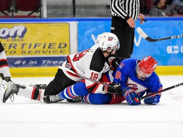 Cornwall Colts Kobe Tallman being held down by Kemptville 73's Ty White on Thursday December 1, 2022 in Cornwall, Ont. The Colts lost 4-1. Robert Lefebvre/Special to the Cornwall Standard-Freeholder/Postmedia Network