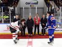 Robert Lefebvre/Hockey Canada Images
Canada West captain Liam Watkins, and U.S. captain Cole Knuble prep for the ceremonial faceoff from members of Dale Hawerchuk's family and former Cornwall Royals teammates prior to their game at the World Jr. A Challenge at the Cornwall Civic Complex on Sunday, Dec. 11, 2022.