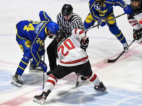 Robert Lefebvre/Hockey Canada Images Sweden's Simon Zether and Canada West's Ethan Zielke meet during play in the World Junior A Challenge, held at the Cornwall Civic Complex on Thursday, December 15, 2022. Sweden won the match 5-3.