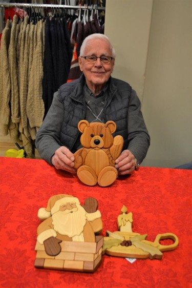 Artistic woodworker, Lloyd Lintott of High River has been at the Christmas Market for almost 20 years. He specializes in Intarsia, which goes back to the 15th Century, an Italian decoration of a mosaic of wood fitted and glued into a wooden support. Photo by Dana Zielke