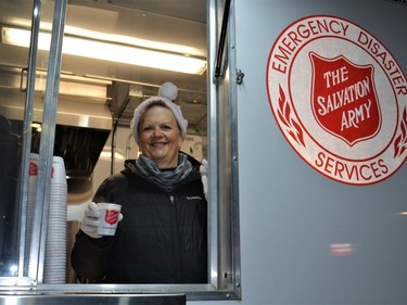 Debbie Kowalyk of the High River Salvation Army handed out delicious hot chocolate and a cookie at a hot chocolate station on the Santa Claus Parade route on Friday, Dec. 2nd. Photo by Dana Zielke