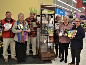 For the month of December, find local High River authors books at the High River Sobeys - (L to R) Paul Milligan, standing in for his daughter Heather, Marcelle Dube, Bruce Masterman, Lorrie Morales, Linda Rakos and Marcia Lee Laycock. Photo by Dana Zielke