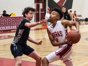 Cochrane Cobras Will Jacques moves in for a layup against the George McDougall Mustangs at Cochrane High School on Wednesday, Dec. 14, 2022. The Cobras beat the Mustangs 90-77.