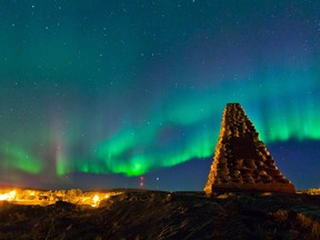 Northern lights fill the sky over monument hill in Fort Chipewyan, Alta. on September 13, 2013. Ryan Jackson/Postmedia Network