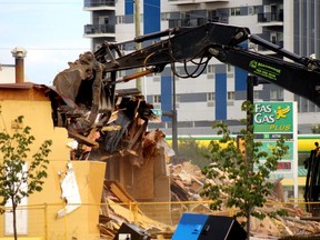 Work crews demolish the old A&W restaurant on the corner of Franklin Avenue and Morrison Street in downtown Fort McMurray on Wednesday, August 3, 2022. Laura Beamish/Fort McMurray Today/Postmedia Network