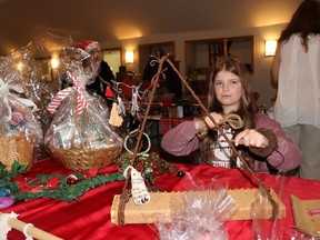 Lilly-Anna LeClercq worked on a wreath for her business, Heart and Hands Designs, at the Greencourt Christmas Market.