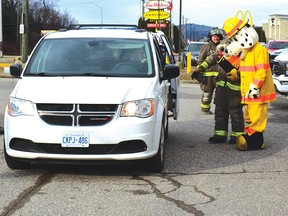 Photo by KEVIN McSHEFFREY
The 32nd Annual Elliot Lake Fire Services Christmas Food Drive on Saturday collected more than $12,000 for the Elliot Lake Emergency Food Bank. Even Sparky got into the act of collecting donations from the public.
