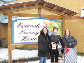 Photo supplied
Kelly Yusko, life enrichment coordinator for the Espanola Nursing Home, stands between artisans Connie Miron and Roselyn Andress as they present her with some specially crafted gifts for the nursing home residents.