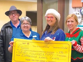 Photo supplied
The Espanola Lions Club is always thrilled to support the Lions Christmas Telethon. Thanks to Joe and Elly Charette, Sonja Lamothe and Amy Mathie for helping on the phones and presenting our cheque for $750 to help out. We think they had a good time…we know they had a good time.