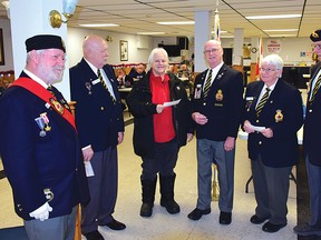 Photo by KEVIN McSHEFFREY
In December, the Royal Canadian Legion Branch 561 in Elliot Lake donated $20,000 split among four local groups. Legion members Aubrey Millard, Don MacLean, Bob Jones, Fay Tait and Al Warman presented three cheques of $2,000 each to Major Darlene Hastings (third from left) of the Salvation Army in Elliot Lake.