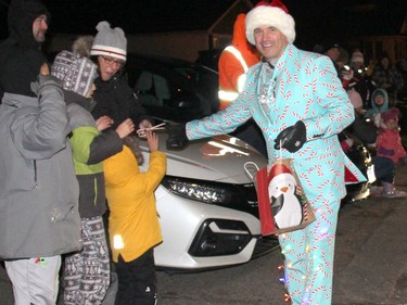 New Petawawa Mayor Gary Serviss helped spread seasonal cheer, handing out candy along the parade route wearing a powder-blue suit decorated with candy canes, wearing some Christmas lights and sporting a Santa hat. Anthony Dixon