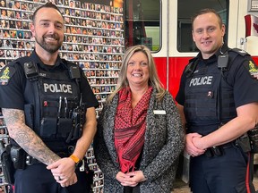 Sergeant Danny Lomness and Constable Mike Dowsley, from the Lethbridge Police Service Traffic Response Unit, stand alongside Anita Huchala, president of MADD Lethbridge, during the 2022 launch of Project Red Ribbon.