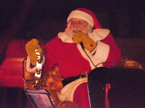 Santa Claus waves to a crowd during his annual Parade of Lights in Stratford on Dec. 5, 2022.