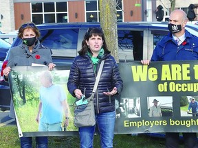 Janice Martell, middle, of the Occupational Disease Reform Alliance, makes a point at the Ontario Network of Injured Workers Groups rally outside of Sudbury MPP Jamie West's office in Sudbury, asher campaign continued last year,  Postmedia Network