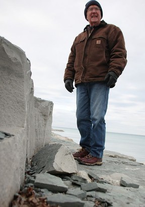 Al Jones says he's concerned about pieces of armor stone coating breaking off at the Bright's Grove shoreline.  (Tyler Kula/ The Observer)