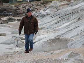 Al Jones says he's concerned about pieces of armor stone coating breaking off at the Bright's Grove shoreline. (Tyler Kula/ The Observer)