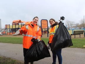 Imperial Oil employees Alaina George and Melissa Gonzalez are pictured helping clean up Rainbow Park in Sarnia. (Submitted)