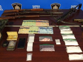 Sarnia police provided this photo of drugs and weapons allegedly seized Thursday at a residence on Cardiff Drive in the city.