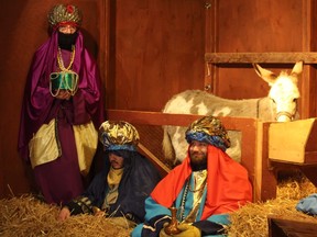 Taking part in the live nativity scene Thursday at Sarnia's Redeemer Lutheran Church are, from left, Barb Barraclough, Kristian Barraclough and Matthew Paisley.