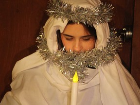 Jamie Guthrie plays the role of an angel in the live nativity scene Thursday at Sarnia's Redeemer Lutheran Church in Sarnia.