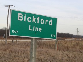 A sign on Highway 40 marks Bickford Line near the Bickford Oak Woods in St. Clair Township.