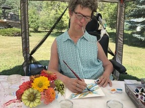 Parkland County's Kathryn Penner, who was diagnosed with muscular dystrophy (MD) at birth has found a new passion in painting the outdoors. Photo submitted.