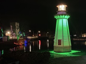 The lighthouse stationed in Lake George at Simcoe's Wellington Park changes colour during the Simcoe Christmas Panorama light display. SIMCOE REFORMER
