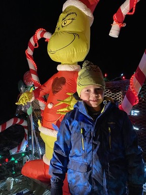 Weston Craft's smile was sure to warm the Grinch's heart during the Waterford Santa Claus Parade on Saturday night.  SIMCOE REFORM