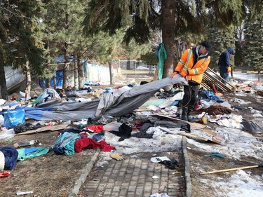 A crew from Reliable Cleaning Services remove debris from an encampment at Memorial Park in Sudbury, Ont. on Monday April 4, 2022. The City of Greater Sudbury set a deadline of April 1, 2022 for occupants of the encampment to leave the park. John Lappa/Sudbury Star/Postmedia Network