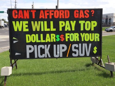 A "sign of the times." An automobile dealership in Sudbury, Ont. has this sign posted outside the dealership on Tuesday May 17, 2022. Gas prices topped $2 a litre at times in 2022, although they have dropped in recent months. John Lappa/Sudbury Star/Postmedia Network