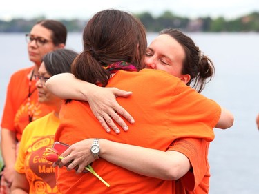 Two women share a hug at a ceremony at Ramsey Lake in Sudbury, Ont. on Friday May 27, 2022, in memory of Indigenous children who never came home, in particular, the original 215 children in Kamloops, B.C. John Lappa/Sudbury Star/Postmedia Network