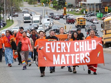 Participants take part in a march in Sudbury, Ont. on Friday May 27, 2022, in memory of Indigenous children who never came home, in particular, the original 215 children in Kamloops, B.C. John Lappa/Sudbury Star/Postmedia Network