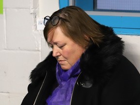 Marlene Gorman, executive director of YWCA Sudbury Genevra House, participates in a moment of silence at a vigil for the National Day of Remembrance and Action on Violence Against Women at the Percy Park Community Hall on Dec. 6.