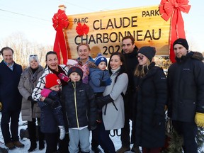 Claude Charbonneau (at the back in the blue jacket) and his family, as well as several dignitaries, were on hand at a ceremony for the official renaming of Percy Park to Claude Charbonneau Park on Dec. 8. Charbonneau has been vital in keeping the park in top shape and creating a welcoming environment for families in the Flour Mill.