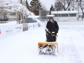 Bing Patterson clears snow off the rink surface at Robinson Playground in Sudbury, Ont. on Friday December 16, 2022, in preparation for the official opening of the revitalized Robinson Playground outdoor rink on December 17. Mayor Paul Lefebvre, Councillor Mark Signoretti, the Robinson Neighbourhood Association and special guests will be on hand for a ceremony at 11 a.m. The rink has a new concrete pad, boards and fencing. There will be a ribbon cutting ceremony followed by public skating, weather permitting. John Lappa/Sudbury Star/Postmedia Network