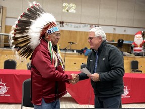 Ring of Fire Metals and Webequie First Nation have signed a memorandum of understanding outlining a framework for collaboration on proposed development in the Ring of Fire. Signing the deal are Webequie Chief Cornelius Wabasse and Ring of Fire Metals Acting CEO Stephen Flewelling.