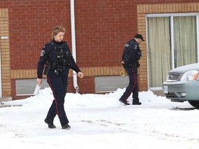 Greater Sudbury Police investigate an early-morning double homicide at the Travelodge Hotel on Paris Street on Tuesday.