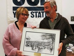 Allan Walsh, artistic director of Jazz Sudbury, was presented with the Oryst Sawchuk Award on Dec. 7 by the Sudbury Arts Council's new president Vicki Gilhula.