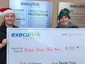 Execulink Thedford store representative Christine Bell presents a cheque to Huron House Boys Home Executive Director Brett Gatt on Nov. 30.
Handout/Sarnia This Week