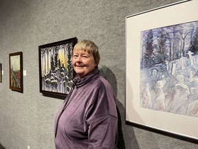 Cathy Cribbs stands in between her two works depicting Deadman’s Point at the opening of “Honouring the Past,” the 75th-anniversary show of the Porcupine Art Club. The club’s longevity is a testament to the importance of the arts in Timmins. Its mission is to promote art appreciation, education, and the professional development of it’s members.NICOLE STOFFMAN/The Daily Press