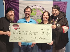 Rock Solid Wrestling donated $2,109 to the Seizure and Brain Injury Centre last week. Proceeds were raised from Rock Solid's Resurgence wrestling event held at École secondaire catholique Thériault on Saturday, Oct. 15th in front of a packed house of 424 screaming fans. Those attending the cheque presentation, from left, were Marc Ethier, Rock Solid Wrestling promoter here in Timmins, Tyler Tremblay, a client, Anne-Marie Sorsa, executive director for SADIC, and Gord Koosees. who is another client. Resurgence was the first live wrestling event hosted by Rock Solid in Timmins following a three-year hiatus due to the pandemic. Rock Solid Wrestling is gearing up for another wrestling event in the spring. All proceeds from those events are donated to local charities.

Supplied