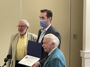 Dr Isaac Bogoch (middle) receiving a Paul Harris Fellowship from North Bay Rotary.