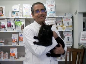 Dr. Paul Arora of Colborne Veterinary Clinic holds Hoshi, the clinic cat.  The Simcoe veterinary clinic marked its 50th year in 2022 serving Norfolk, Haldimand and Brant county areas.  CHRIS ABBOTT