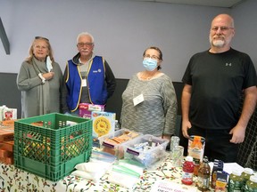 Cycles of Life operates an outreach table in Tillsonburg Thursdays from 11 a.m. to 1 p.m. at the Upper Deck Youth Centre. From left are Cycles of Life volunteers Carole McNeely, Mike Donnelly, Mary Jane Phillips and Tim Smith. CHRIS ABBOTT